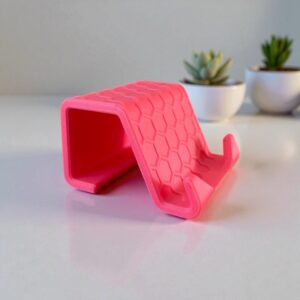 Support smartphone design alvéolé 3D : Un accessoire stylé et pratique pour toutes vos surfaces